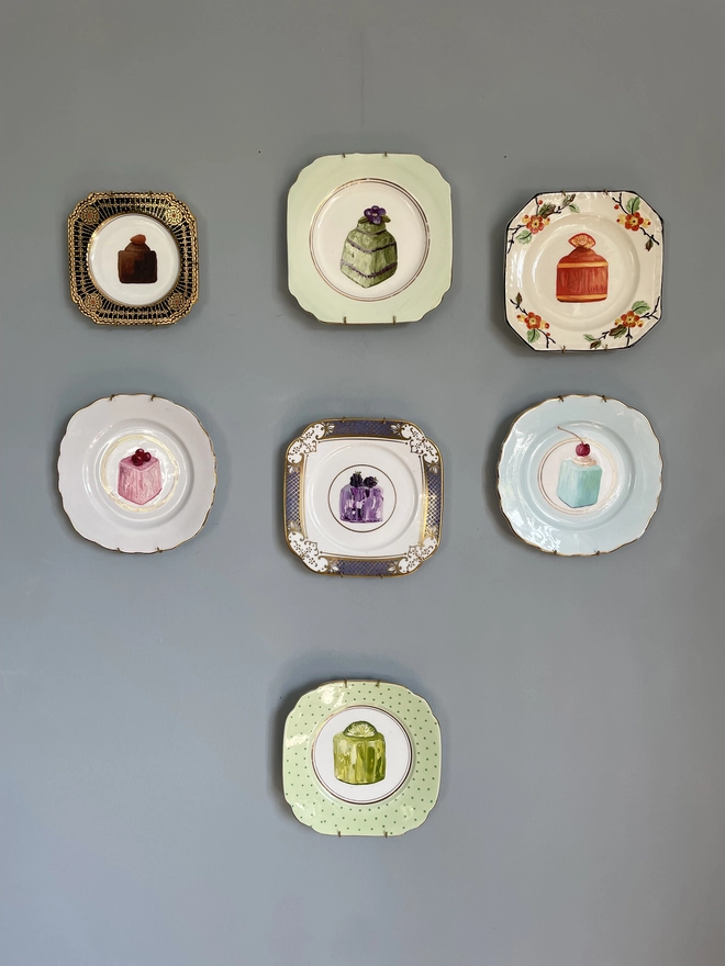 plate scape of 7 square painted plates