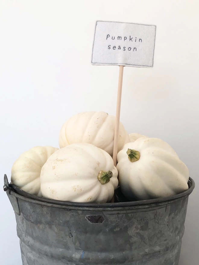 Halloween Embroidered Sign in a bucket with pumpkins
