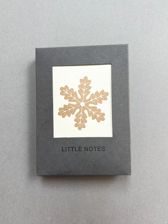 Front of the gift box showing a Gingerbread snowflake little card, all made in the UK