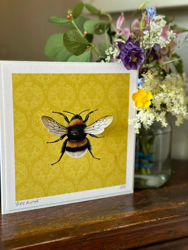 Bumblebee in centre of a square card with 3D wings printed on high quality watercolour paper.