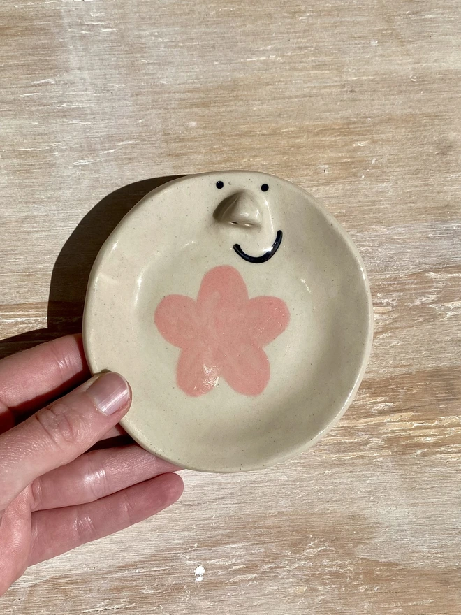 pink daisy trinket tray - held
