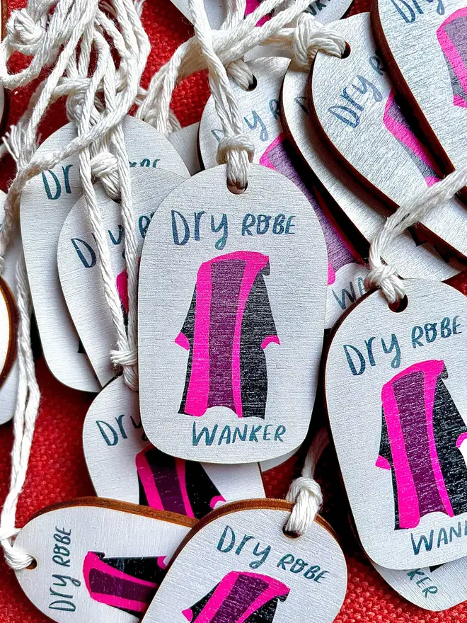 Wooden ornament reads 'dry robe wanker'