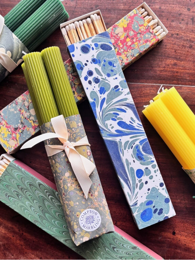 Scalloped Candles & Long Matchbox. A selection of the available colours of candle, all shown fully wrapped.