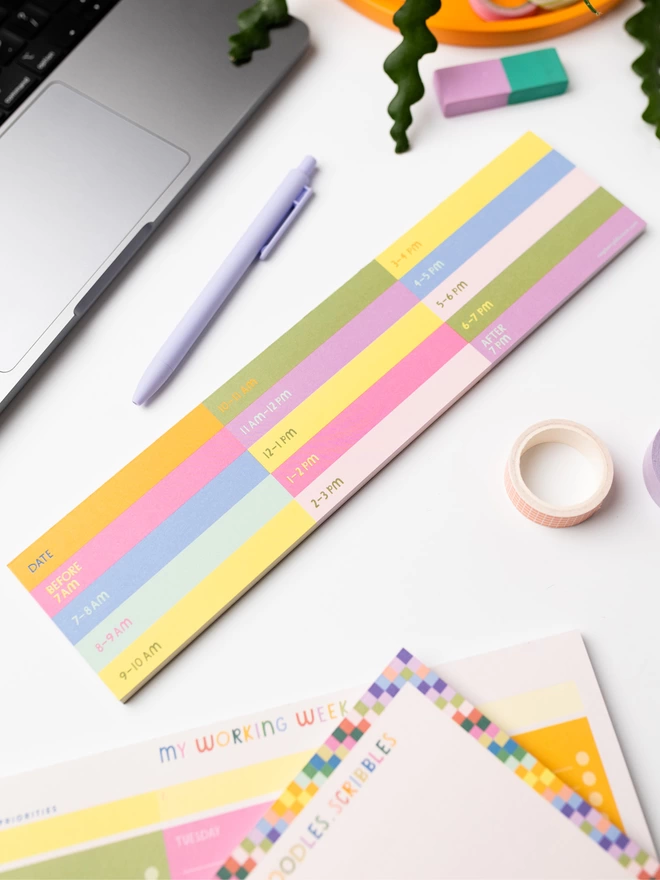 Colourful Raspberry Blossom keyboard notepad sits on the desk near other colourful items from the 'Happiness' Stationery Collection