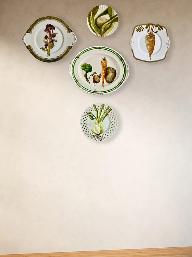 decorated plates on brown wall