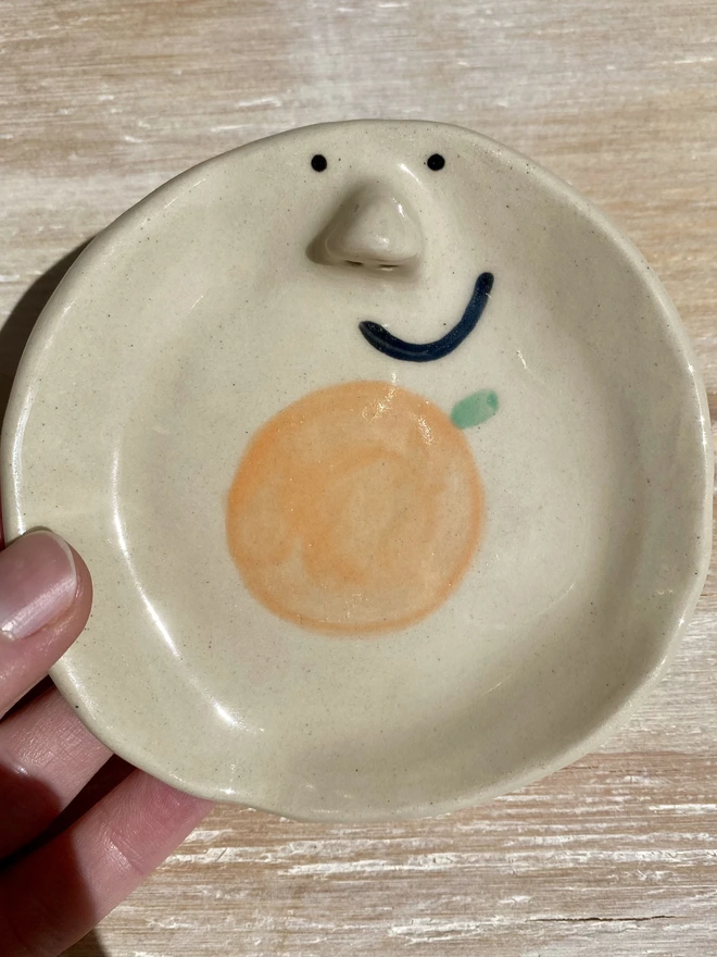 clementine trinket tray - held - close up