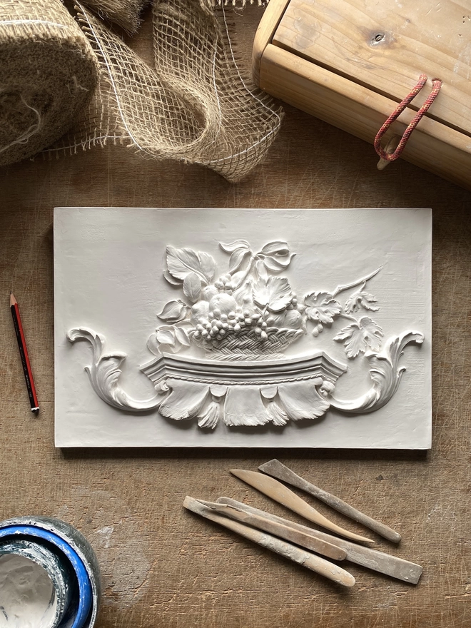 Still Life plaster relief plaque with modelling tools and materials