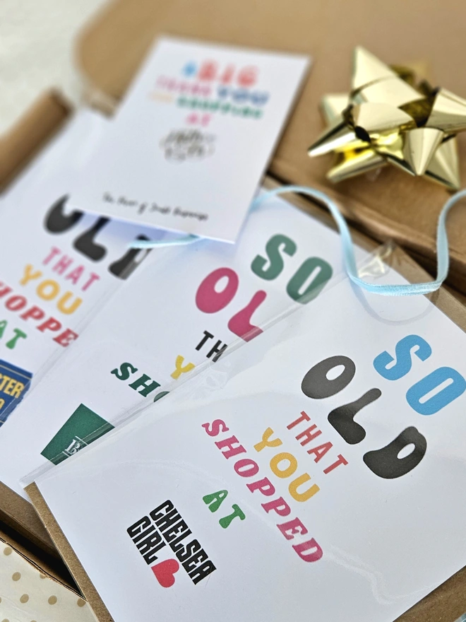 A photograph of a set of nostalgic shop cards in different designs in a box with a thank you card for shopping at Holly and Co