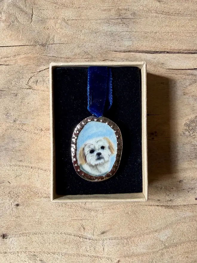 custom pet portrait pendant miniatures. a miniature painted dog portrait in a pendant frame.