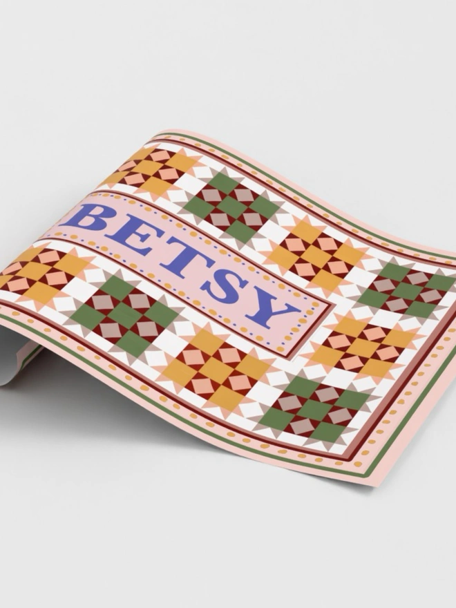 Custom name wall art featuring personalised patchwork print with a child's name taking centre stage, perfect for nursery and children's bedroom decor