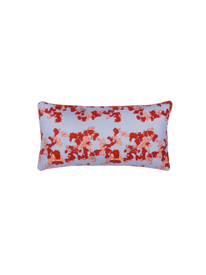blue floral cushion on blank background