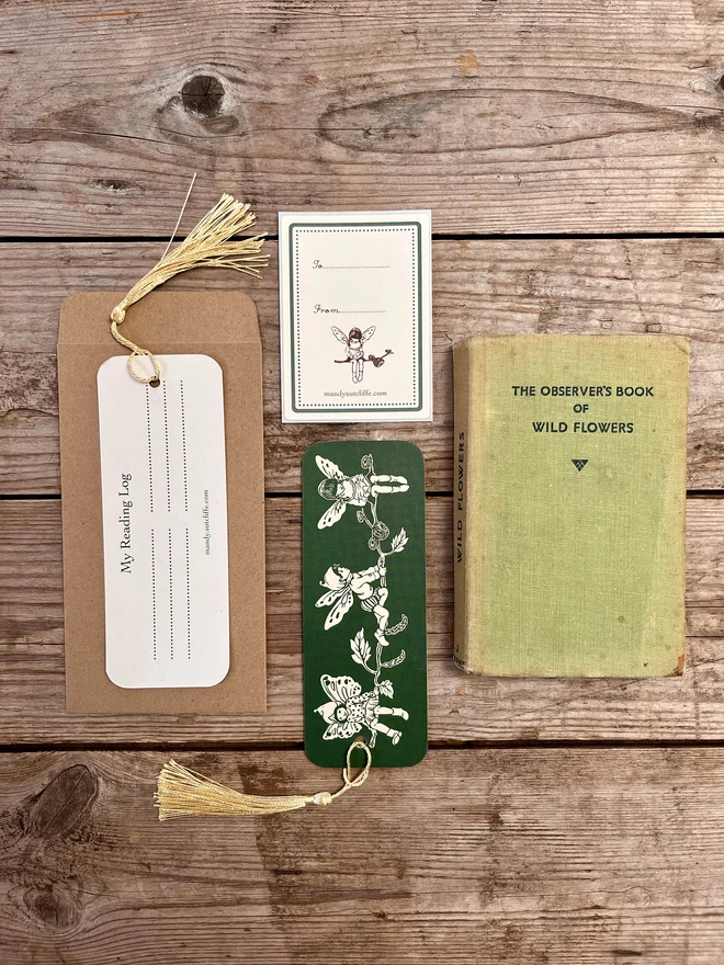 a flat lay image showing a bookmark and a kraft envelope and label