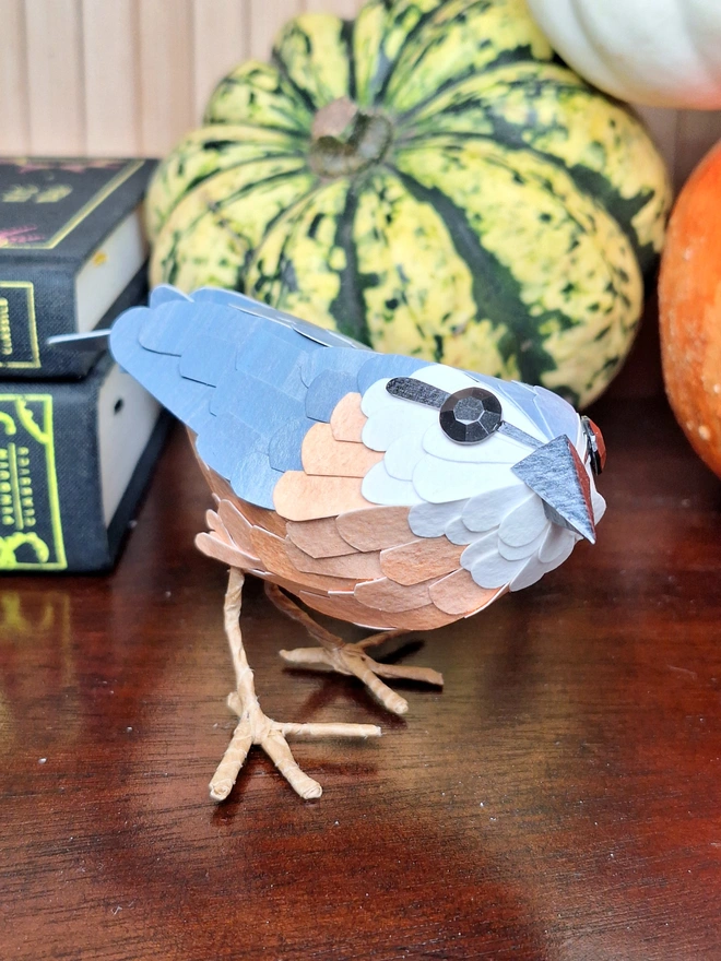 Handmade bird sculpture depicting a nuthatch