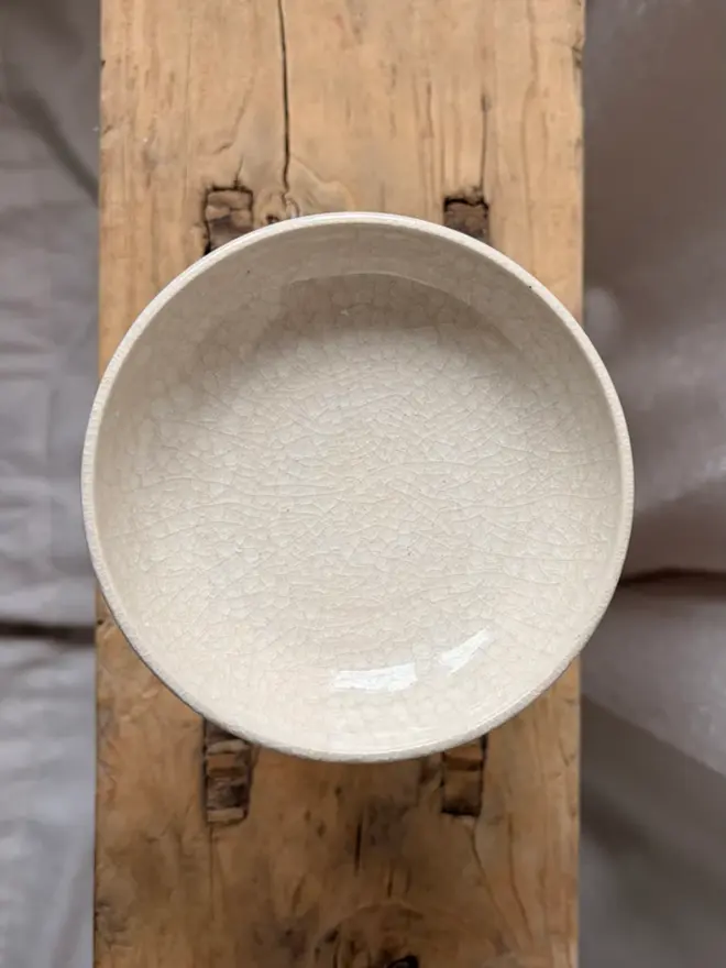 Pillar Candle Holder From Above on wooden stool