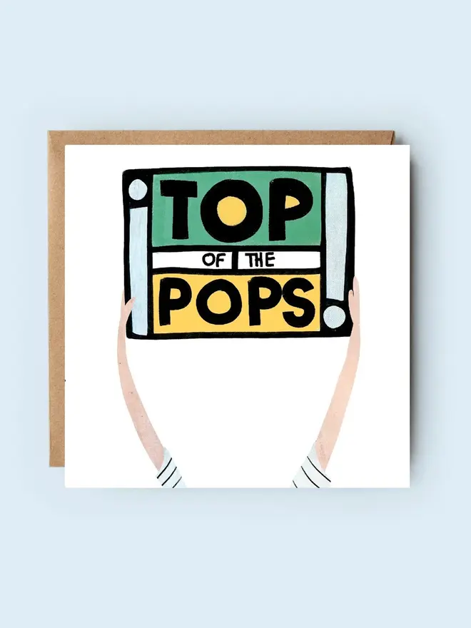'top of the pops' illustrated fathers' day card. illustrated hands holding up a retro radio emblazoned with 'top of the pops'.