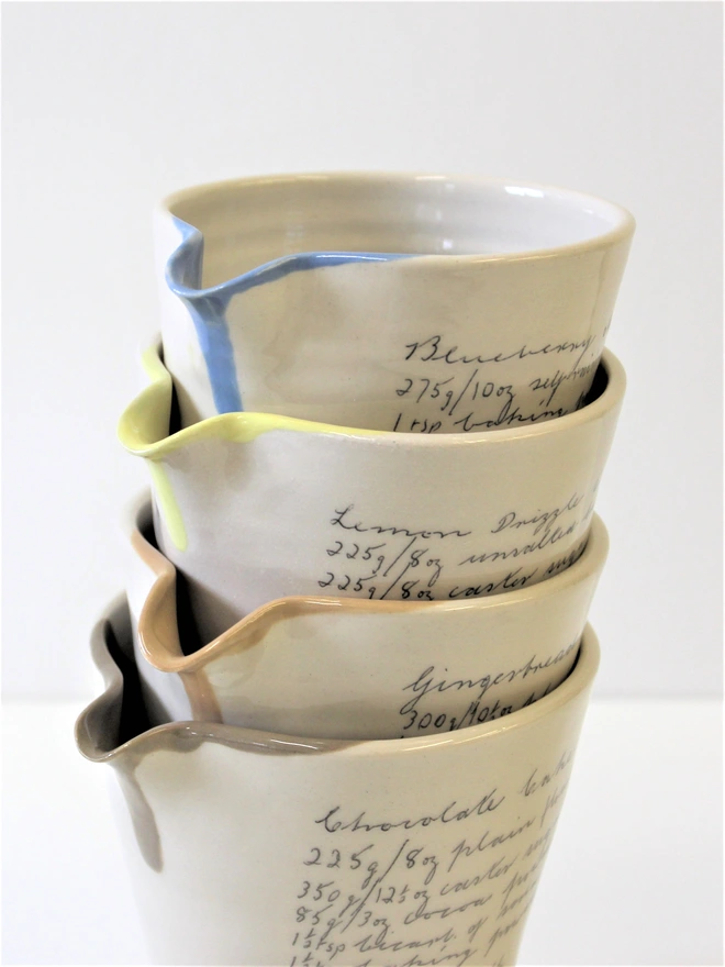 stack of ceramic handheld recipe jugs