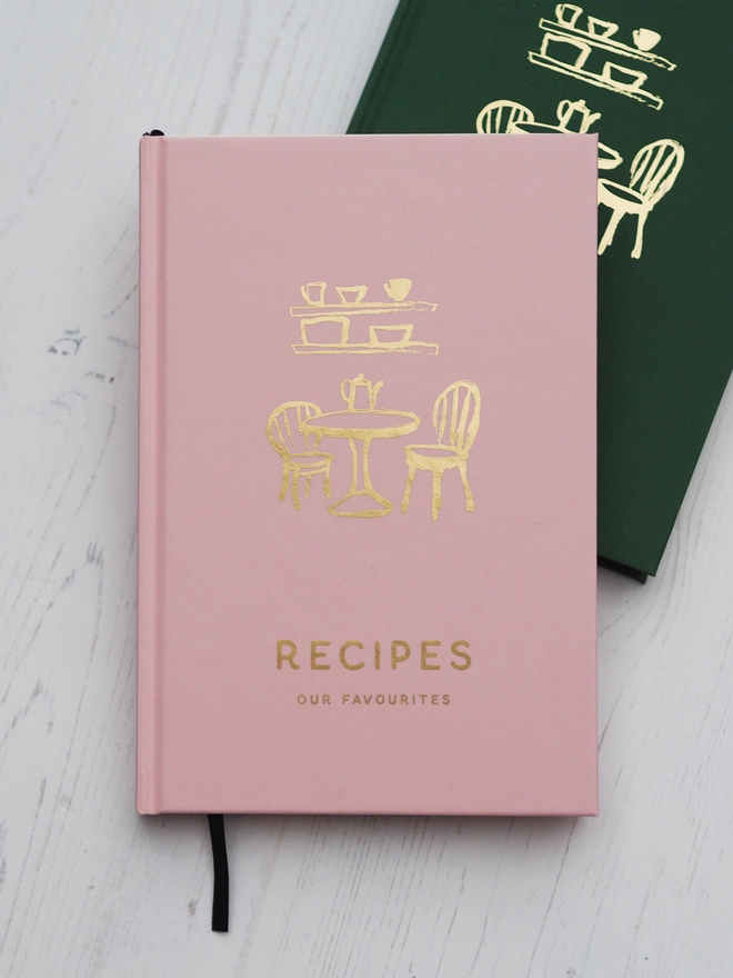 personalised hardcover book in a light pint saying "recipes" "our favourites"