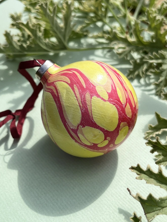 Hand-marbled round ceramic Christmas bauble