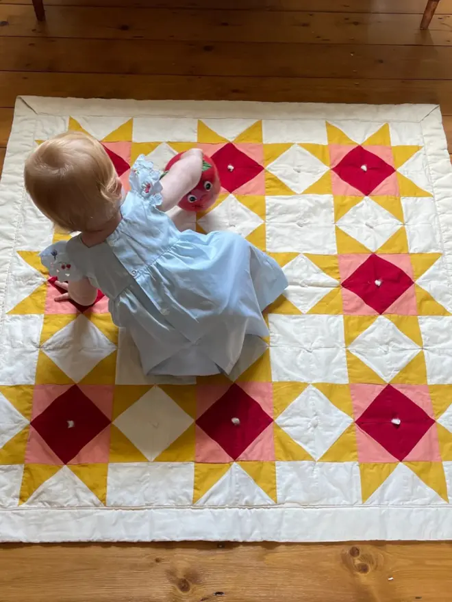 Warm Hearth Quilt Kit, on the floor. 