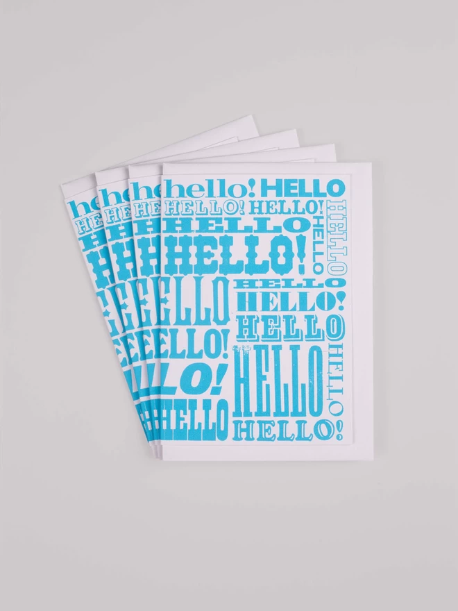 Blue Greetings Card with Hello written all over it in different fonts a pack of 4