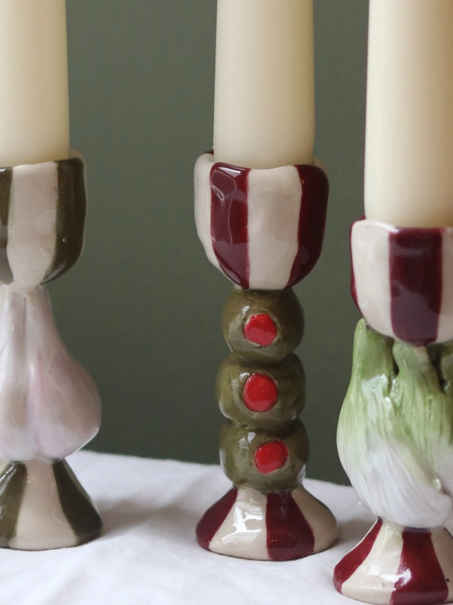 candlestick with a trio of olive design