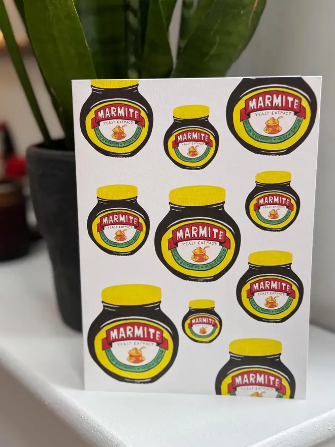marmite jars illustrated card. card placed on mantelpiece.