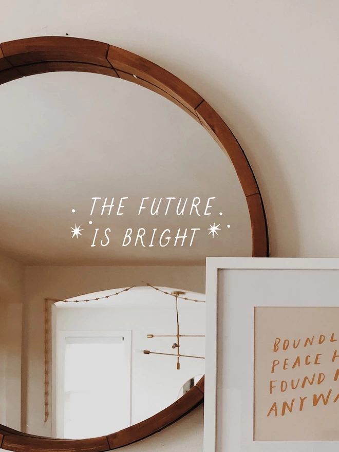 the future is bright decal on a mirror