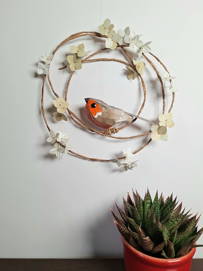 Kaper robin bird sculpture on a floral hoop of green hydrangea wall art