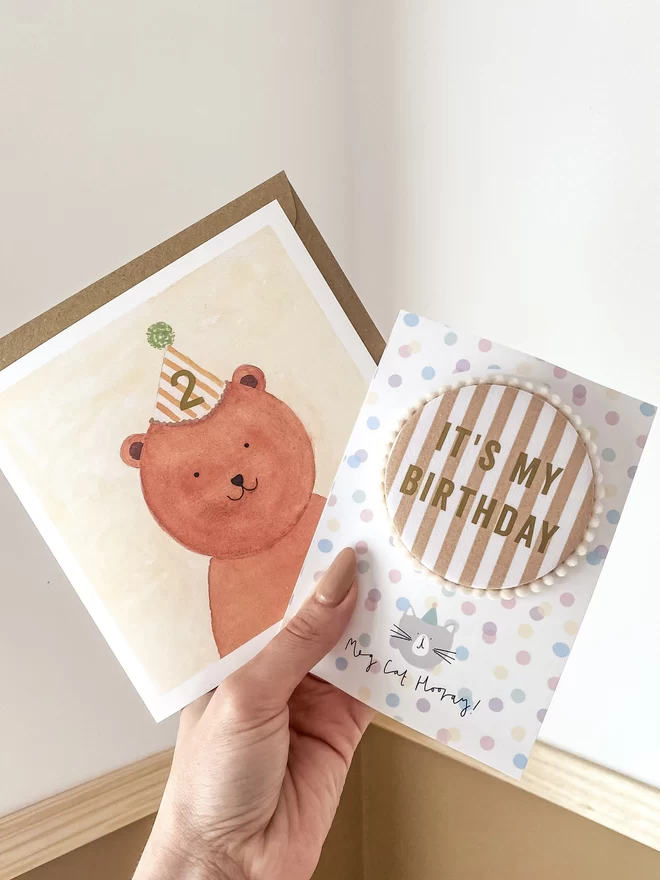 Bruno Bear Birthday Card with Caramel Striped Party Hat and matching Badge