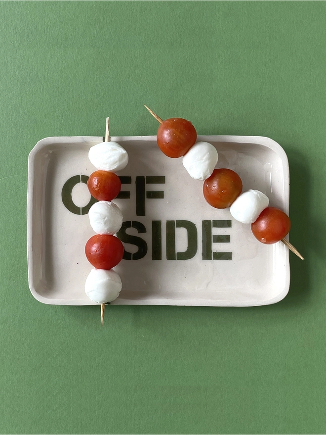 Offside plate with cheese and tomato kebab