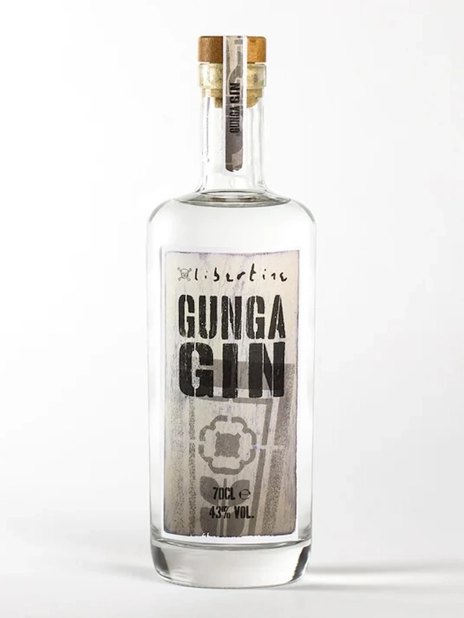 Libertine Gunga Gin, bottle of spirit on a white surface. 