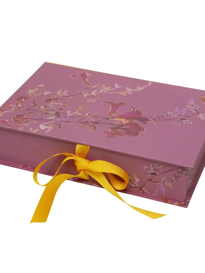 Lidded Portfolio Box, a colourful portfolio box sitting on a plain surface. 