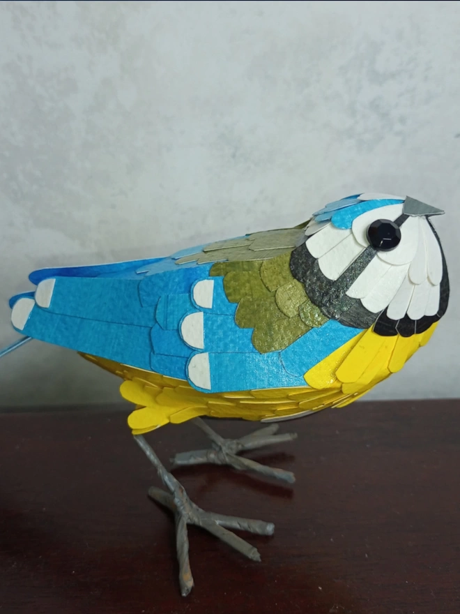paper sculpture of a blue tit bird