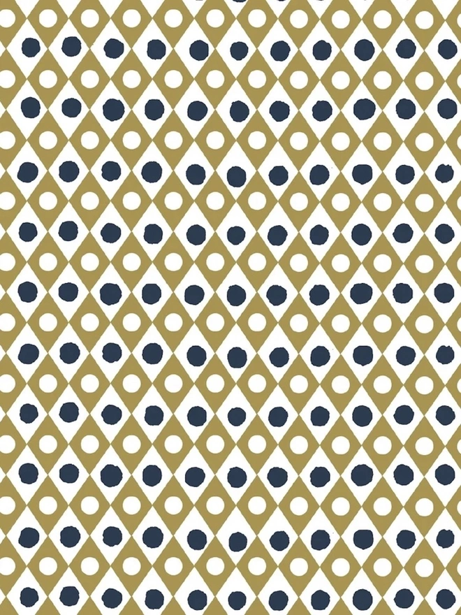 A4 Large Landscape Travel Watercolour Book. Close-up of a block-printed paper pattern with an ochre gold diamond lattice, white circles and navy blue dots. The repeating geometric design suits gift wrapping, bookbinding and paper craft projects.