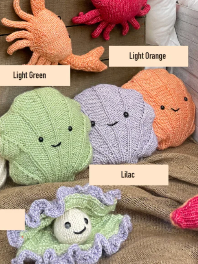 Shell Knitting Kit. Three shells in light green, lilac and light orange.