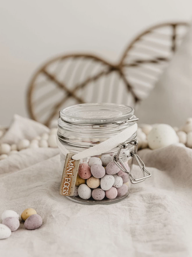 jar of mini eggs with a ceramic 'mini eggs' tag tied around it