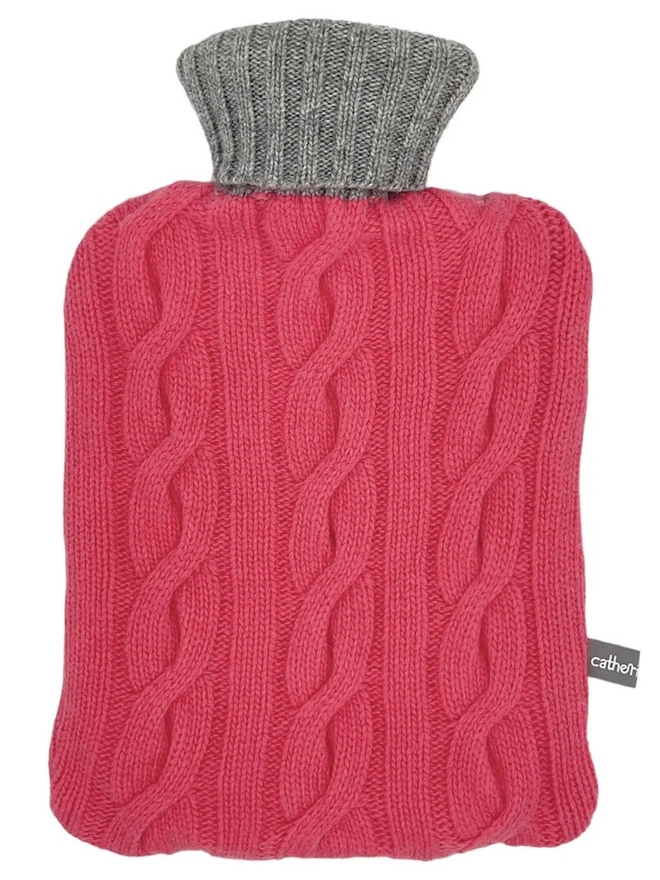 Cashmere Hot Water Bottle Cover, a colourful water bottle sitting on a white plain surface. 
