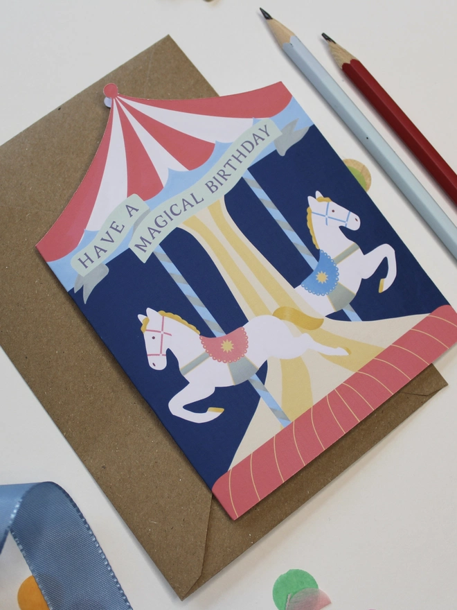 Carousel Circus Birthday card with two horses on a merry go round