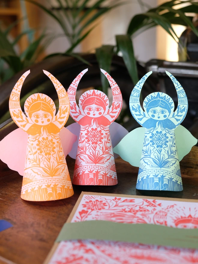 Set of three bright coloured floral 3D angel cards.