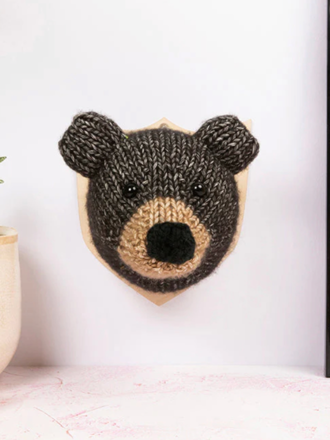 Bear Head Knit Kit. A mini black bear head, completed and mounted.