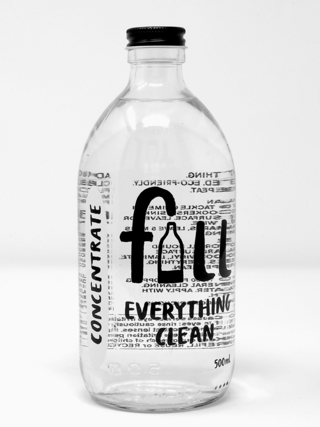 Everything Clean Time to Concentrate. A clear glass bottle with Fill Everything Clean written on.
