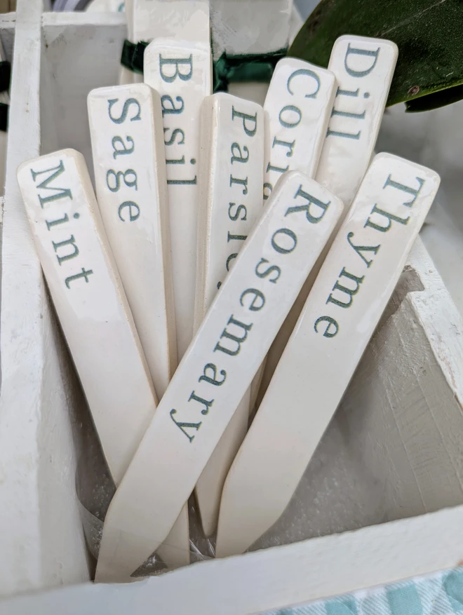 green ceramic herb labels