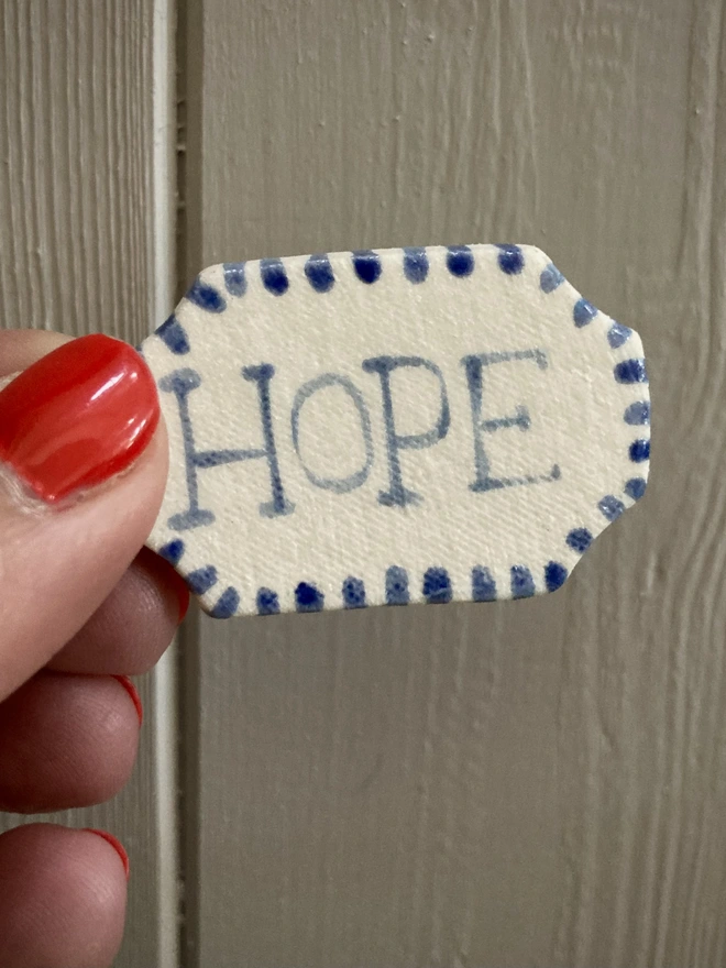Hope Badge held 