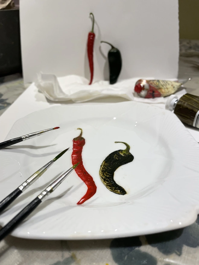painting chillies in the studio