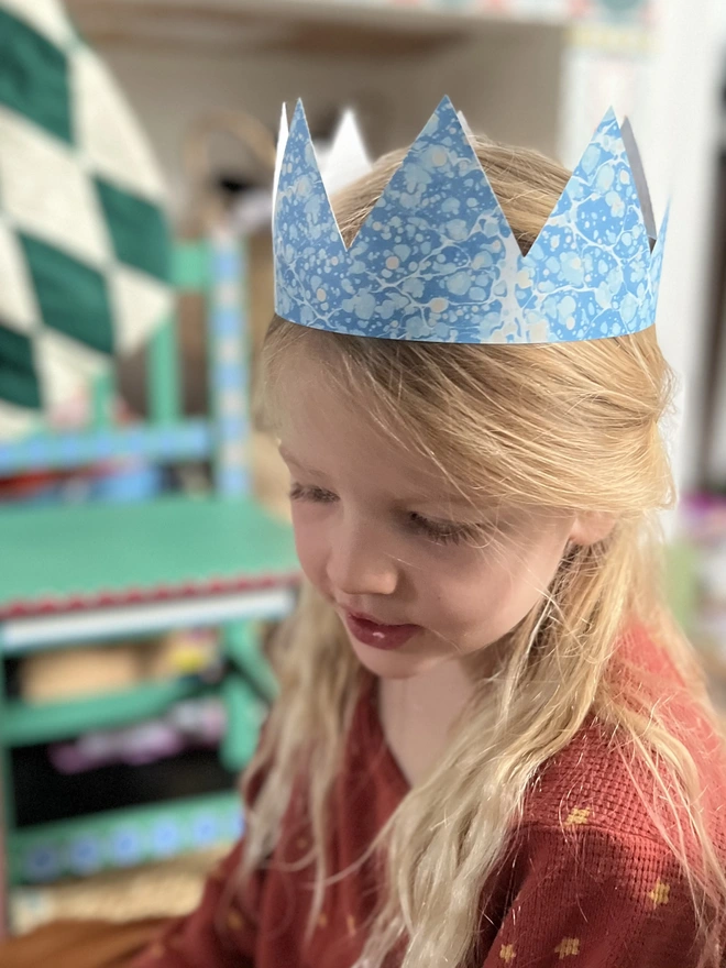 Hand-cut paper crown printed with original marbled designs