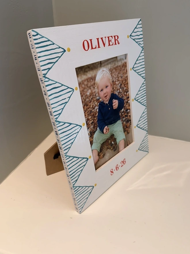 Childs solid oak photo frame with handpainted name. 