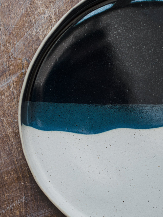 blue and white ceramic dinner plate top view