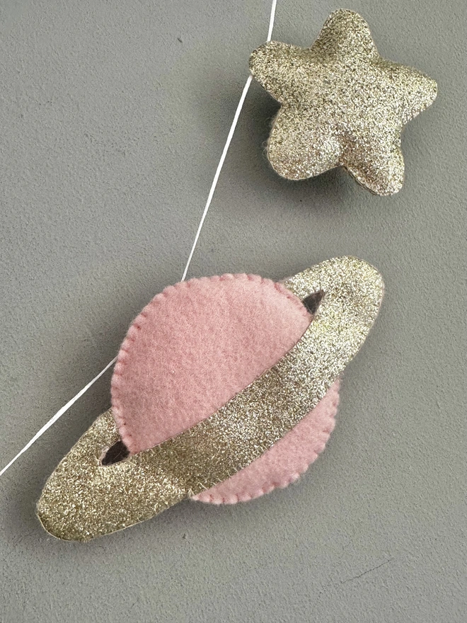 Planet And Stars themed garland hanging in a child’s bedroom, nursery decoration, baby gift 