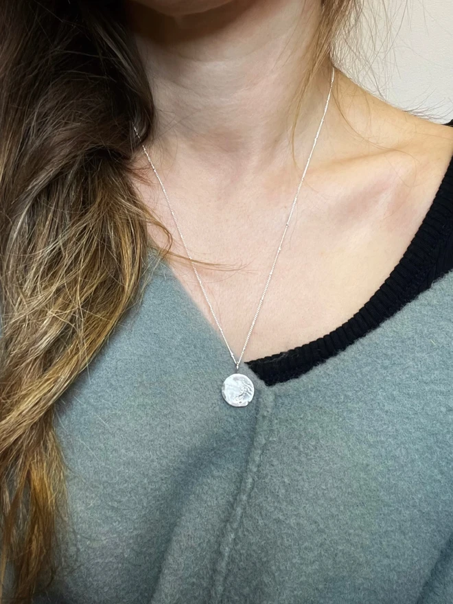Handmade recycled sterling silver moon pendant necklace with organic sand-cast texture on a delicate satellite chain, inspired by the phrase ‘Love you to the moon and back’. Personalised gift jewellery by Celina C Jewellery, a small UK business, find on Holly and Co.