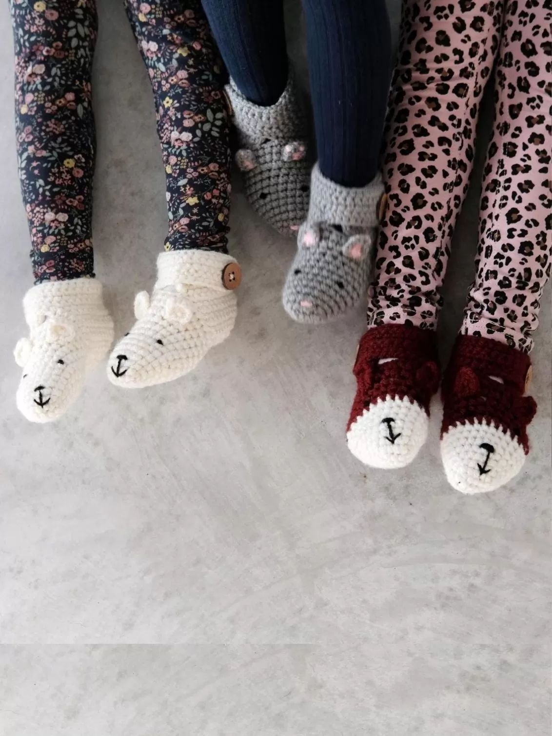 EKA Animal Booties seen on three children.